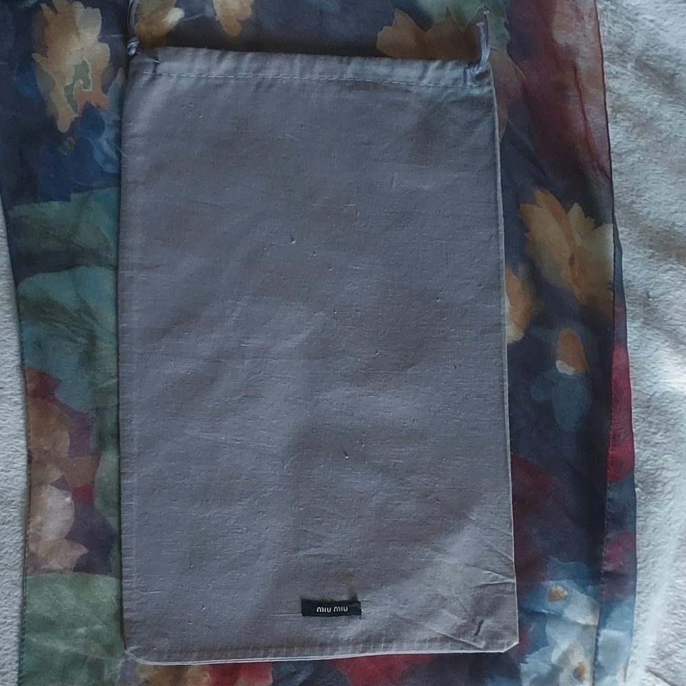 Miu Miu gray dust bag.